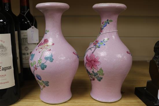 A pair of Chinese pink sgraffito ground famille rose vases